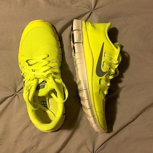 Neon yellow Nike running shoes